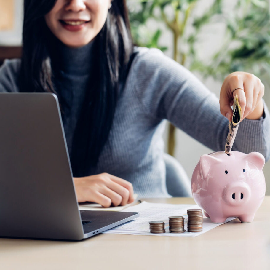 woman working from home concept saving money for finance account woman working from home concept saving money for finance accounting. Saving money wealth concept, Asian business woman hand write management budget for saving cost, cash finance